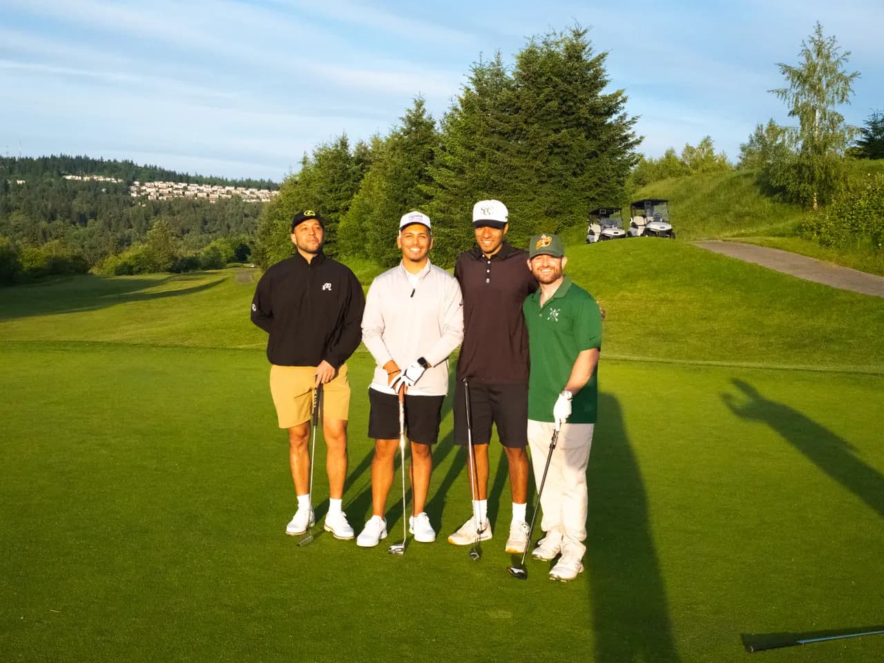 Four 18 Holes to Home guests standing together on a Pacific Northwest course